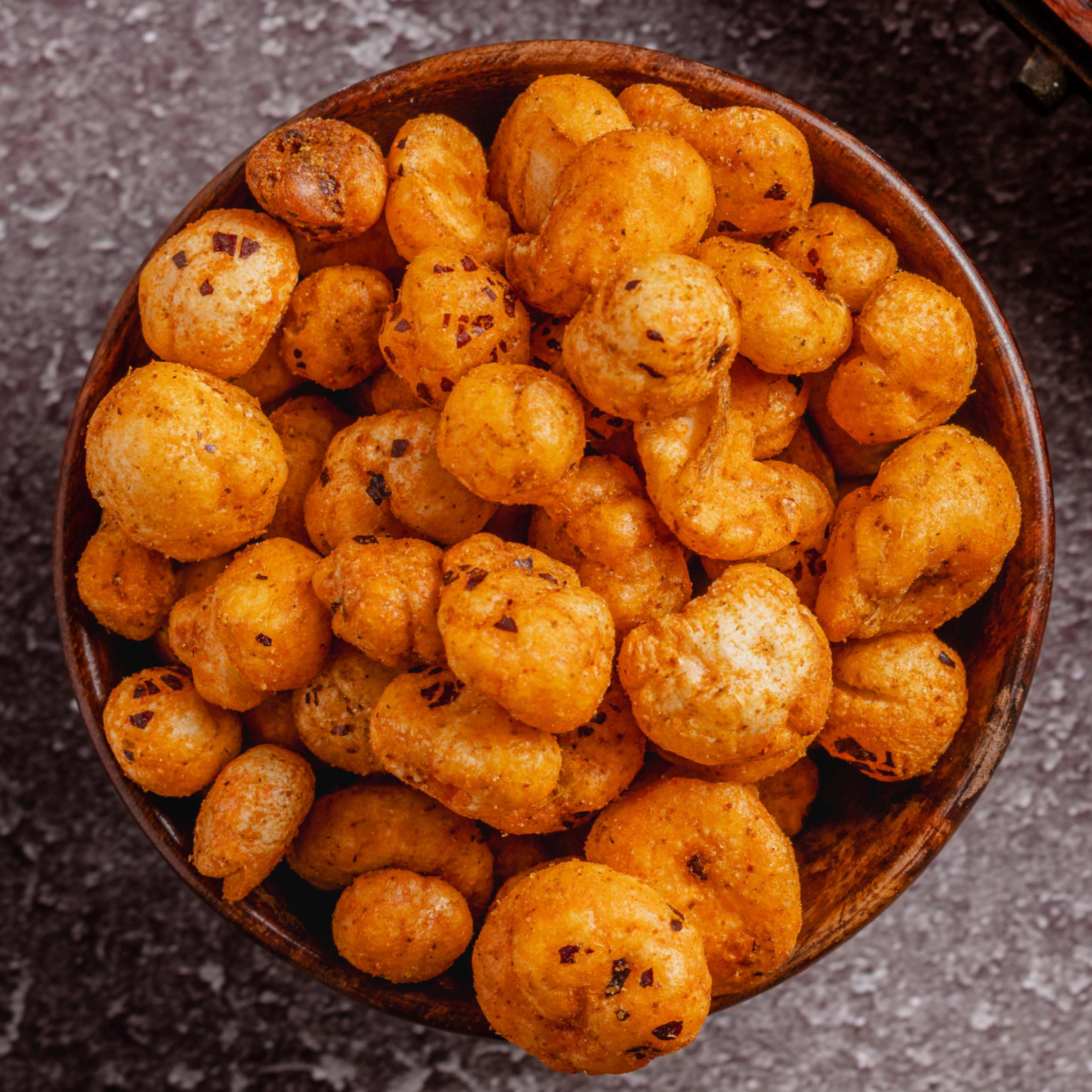 Buy Cajun Hot & Spicy Makhana online from World of Mysore Pak. Crunchy foxnuts with bold cajun seasoning.
