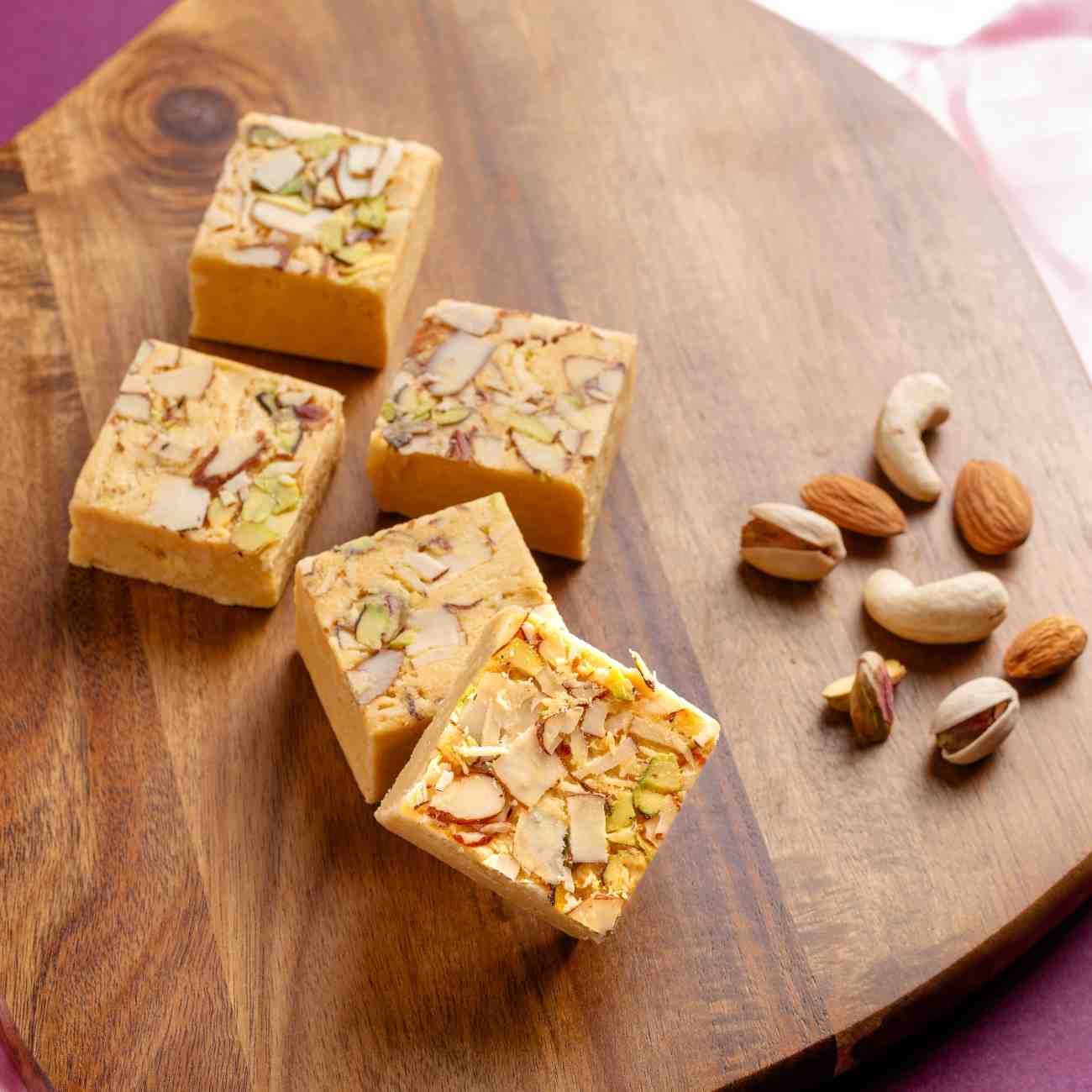 Buy Soan Papdi sweet online from World of Mysore Pak, offers a light, melt-in-mouth texture with authentic flavor.
