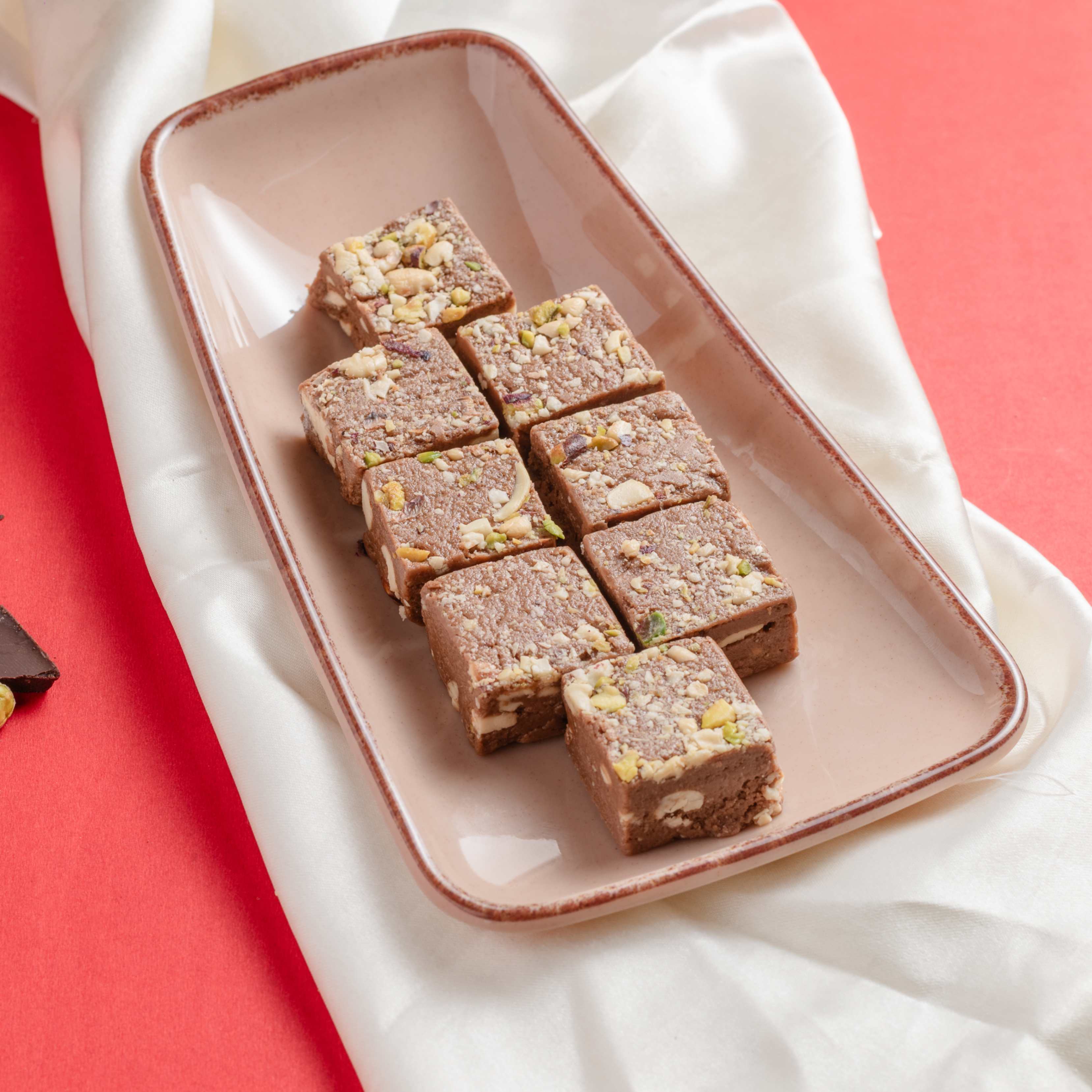 Buy Chocolate Bites online from World of Mysore Pak — rich ghee bites with caramel sugar, nuts, & chocolate flavor.