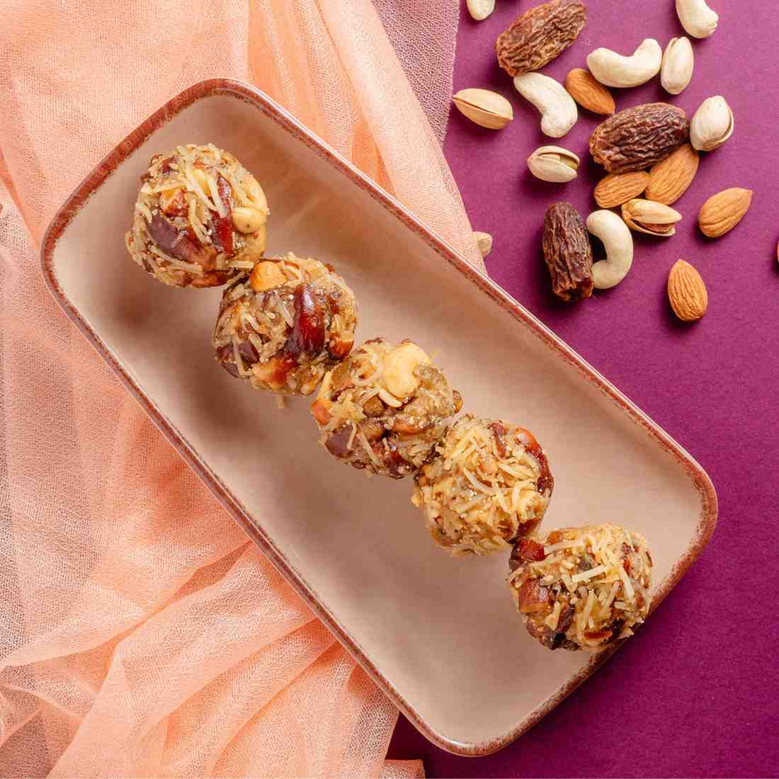Buy Dates and Dry Fruit Ladoo online from World of Mysore Pak — packed with energy, ghee, and crunchy nut goodness.
