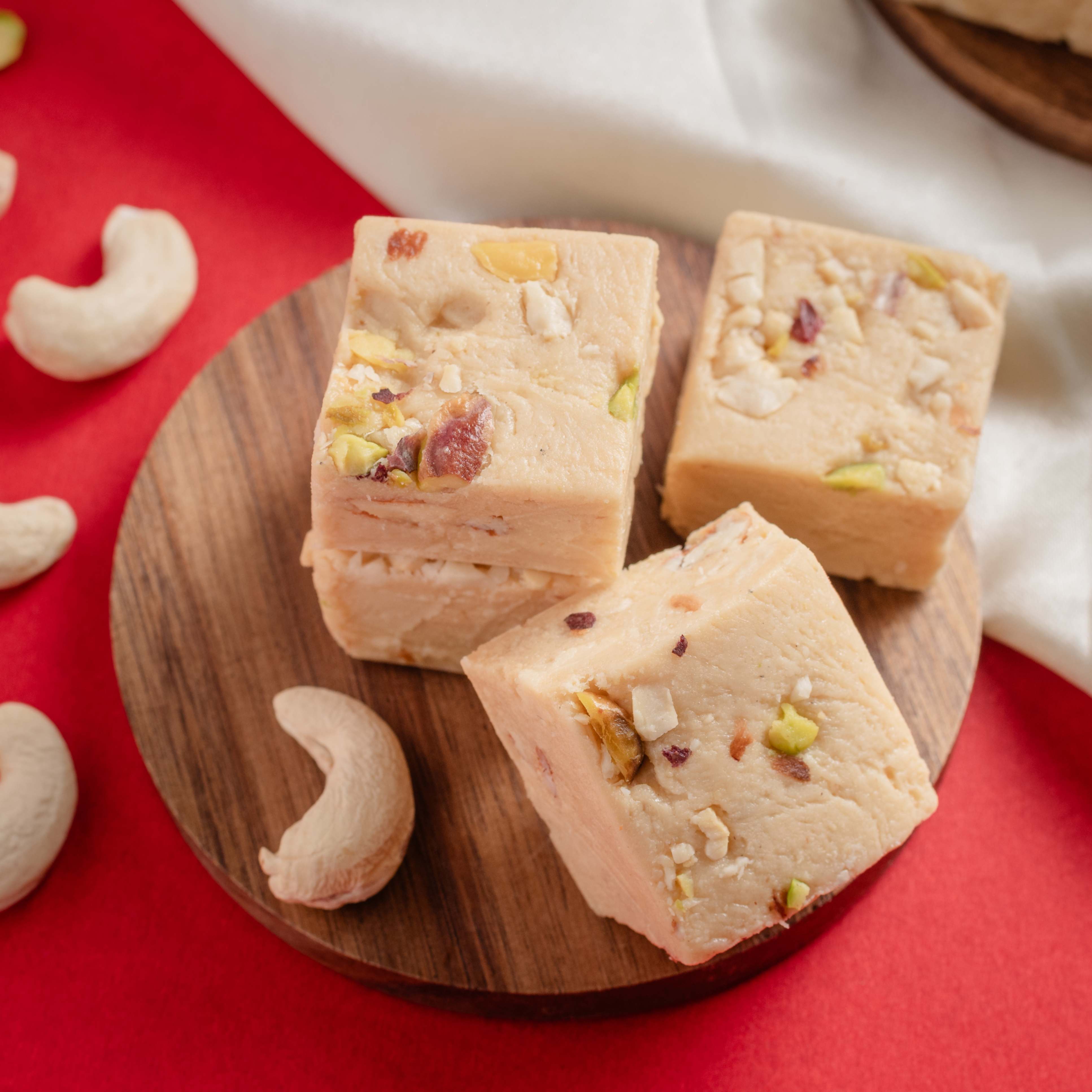 Buy Kaju Bites online from World of Mysore Pak — crisp cashew sweets made with caramelized sugar and pure ghee.