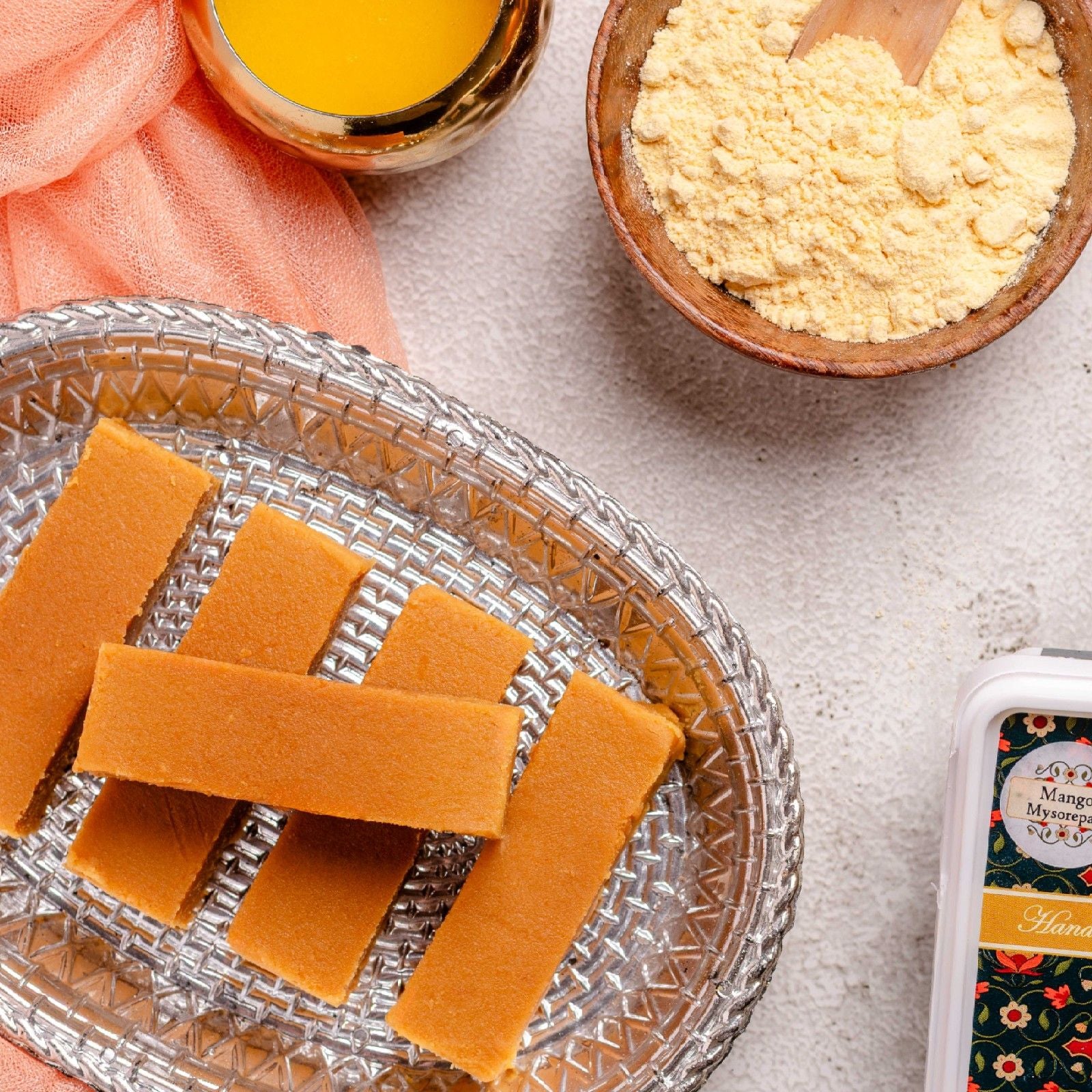 Buy Mango Mysorepak in India online from World of Mysore Pak — smooth ghee delight with fresh mango flavor.