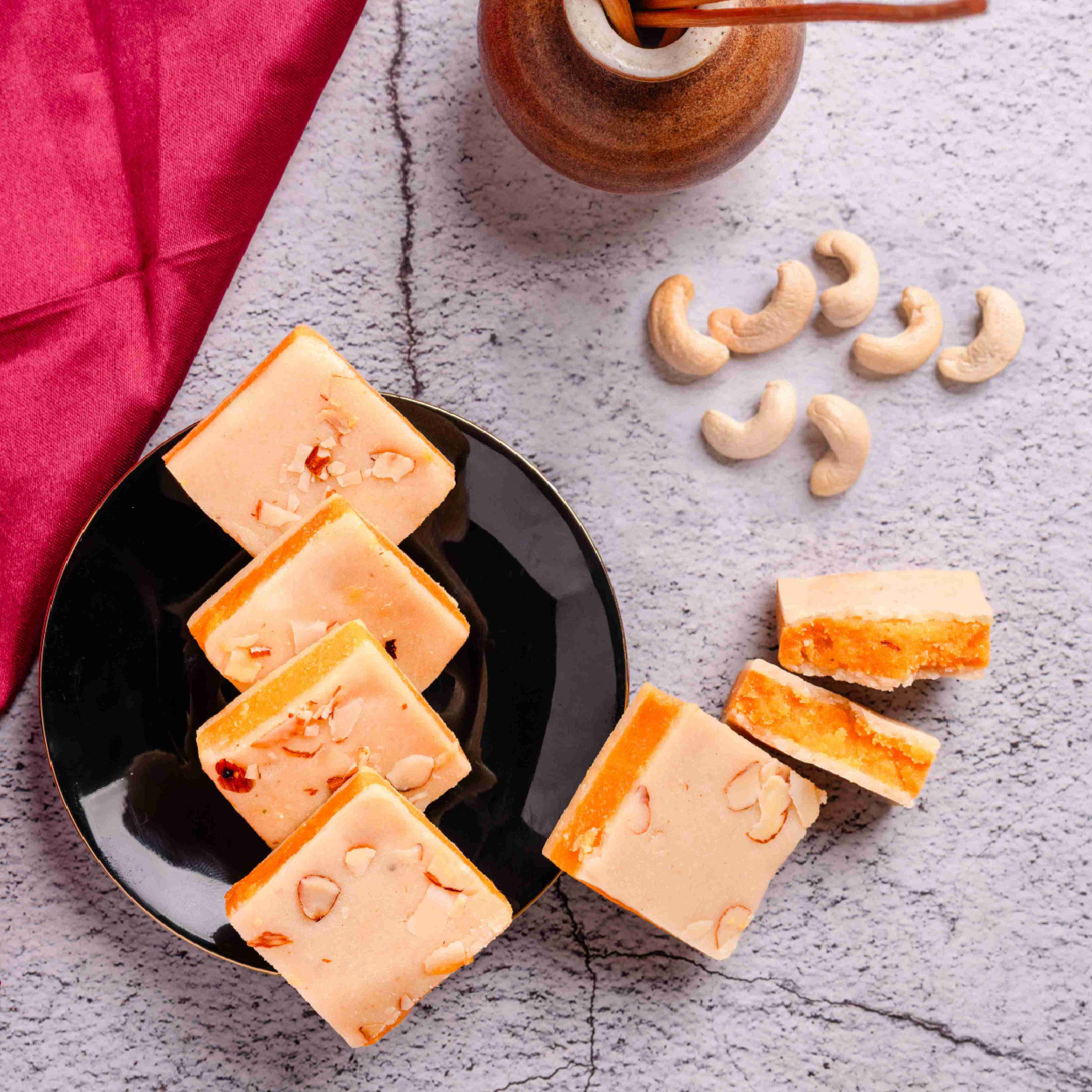 Buy Pa Ka Sandwich online from World of Mysore Pak – a rich kaju and Mysore Pak sweet made with 100% pure ghee.